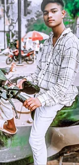 Young man on scooter in urban street scene.