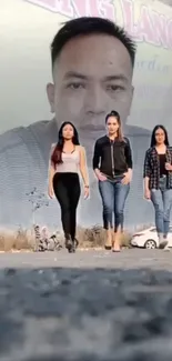 Three fashionable individuals walking beneath a city mural.