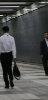 Monochrome urban subway scene with commuters walking.