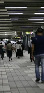 Commuters walking in a modern subway station.