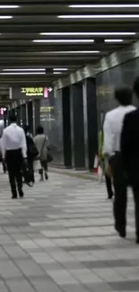 Urban subway station with people walking in a bustling corridor.