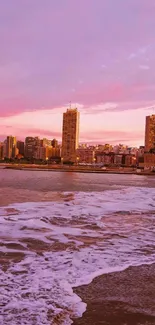 Lavender purple sunset over city skyline and beach waves.