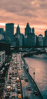 Sunset casting orange hues over city skyline and waterfront.