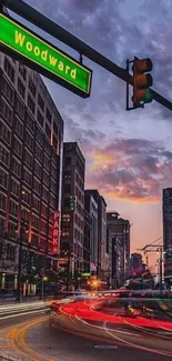 Urban sunset view on city street with traffic lights and buildings.