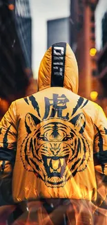 Yellow hoodie with tiger design in urban setting.