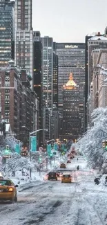 Snow-covered city street with skyscrapers in the background.