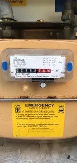 Mobile wallpaper of utility meter with yellow emergency labels.