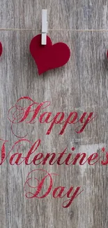 Red heart Valentine's Day wallpaper on wood.