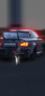 Rear view of a sleek sports car racing with blurred motion.