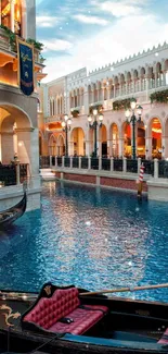 Venetian canal with elegant buildings and gondola in beautiful lighting.