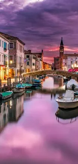 Venetian canal at sunset with vibrant reflections and architecture.