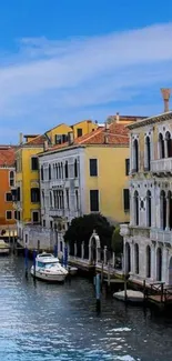 Venice canal with colorful buildings and boats, perfect for a serene wallpaper.