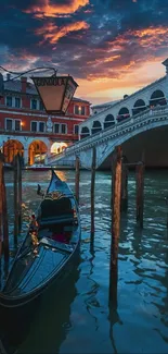 Venice gondola and Rialto Bridge at sunset with vibrant sky and canal reflections.