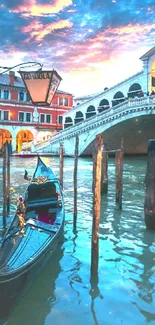 Venice gondola at sunset beneath Rialto Bridge.