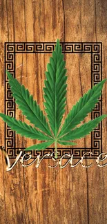 Versace wallpaper with cannabis leaf on rustic wood background.