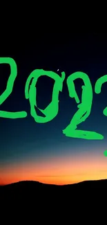 Dynamic 2023 sunset theme with green text overlay on mobile wallpaper.