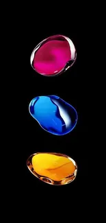 Vibrant abstract wallpaper with colorful drops on a black background.