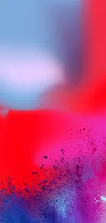 Vibrant abstract wallpaper with red and blue color splash.