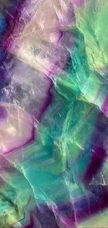 Vibrant crystal texture in green, purple, and blue hues.