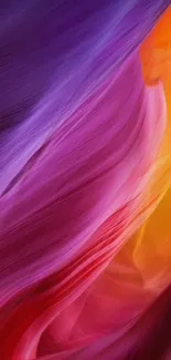 Vibrant abstract wallpaper with purple and orange swirls.