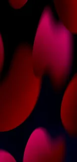 Abstract red and pink gradient mobile wallpaper with dark background.