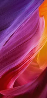 Vibrant abstract wallpaper with purple, red, and yellow flowing shapes.