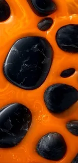 Abstract wallpaper with black stones on orange background.
