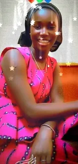 Smiling woman in pink African attire with colorful hearts.