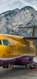 Yellow airplane with mountain backdrop, vibrant colors.