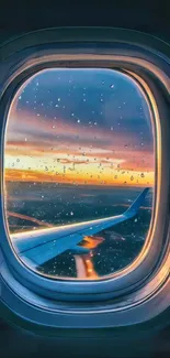 Airplane window view at sunset with raindrops.
