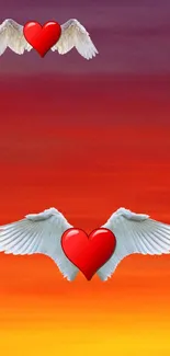 Heart with wings on sunset skyline wallpaper.