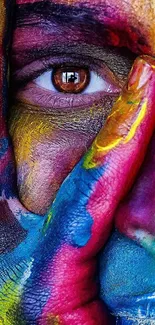 Close-up of an eye with vibrant, colorful paint design.