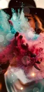 Artistic wallpaper with colorful powder explosion and figure silhouette.