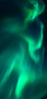 Vibrant aurora borealis with green hues lighting up the night sky.