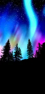 Vibrant aurora borealis over starry night sky with silhouetted trees.