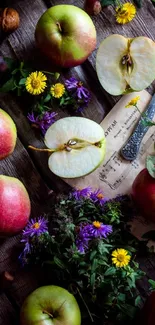 Mobile wallpaper of apples and wildflowers on rustic wooden background.