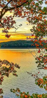 Vibrant autumn leaves framing a tranquil lake at sunset.