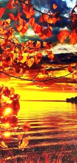 Vivid orange autumn sunset with leaves over a serene lake view.