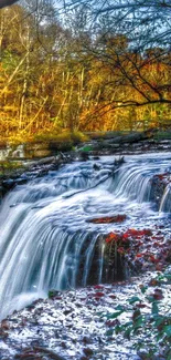 Vibrant autumn waterfall with colorful foliage and serene stream.