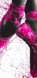 Artistic ballet shoes with magenta splashes on a white background.