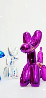 Colorful metallic balloon dog sculptures on white background.