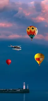 Vibrant hot air balloons and a plane above a lighthouse with a colorful sky.