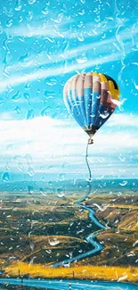 Colorful hot air balloon floating in blue sky with landscape below.