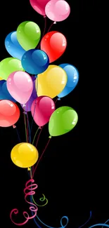 Colorful balloons on a black background wallpaper.