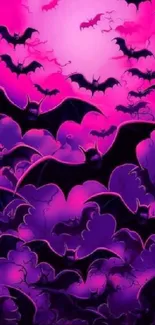 Vibrant wallpaper of bats on purple and pink gradient background.