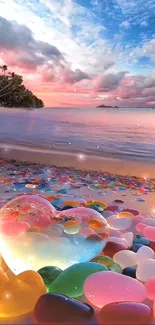 Heart crystal on colorful pebbles at a sunset beach.