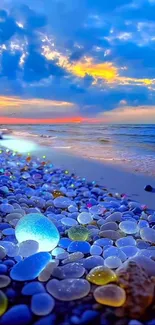 Vibrant beach with colorful pebbles at sunset.