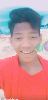 Smiling man in red on beach with colorful bubbles.