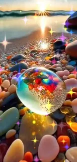 Colorful glass sphere on vibrant beach stones at sunset.