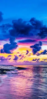 Vibrant beach sunset with colorful sky and ocean view.